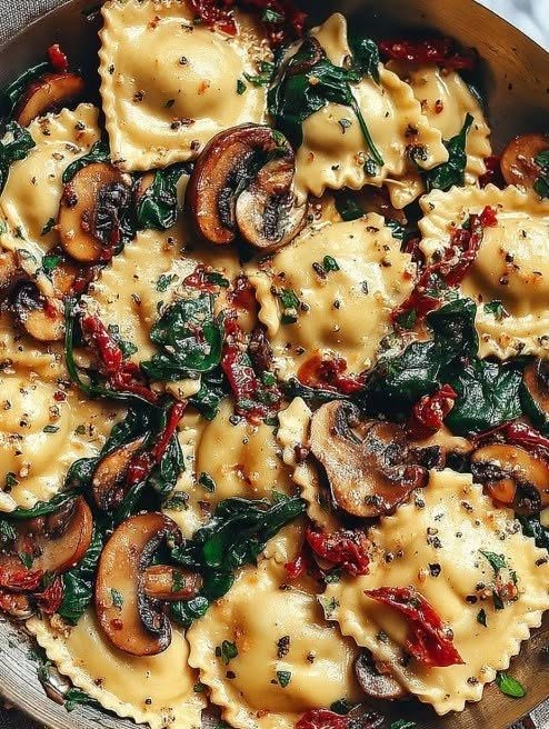 Vegan Cheesy Ravioli with Spinach Mushrooms and Sun-Dried Tomatoes